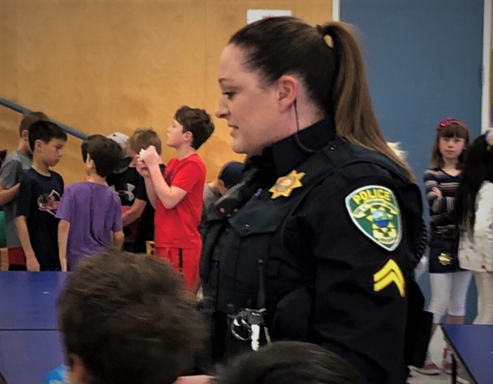 Female officer in lunchroom at school 